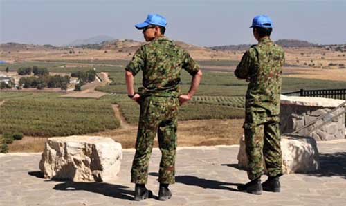 UN peacekeeping forces surveying a landscape