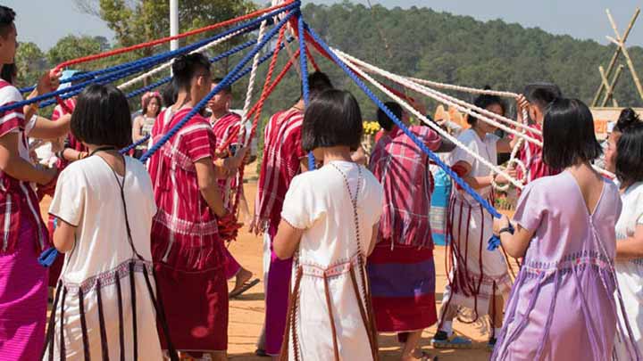 Karen tribal children in traditional clothes performing Karen traditional rope dance